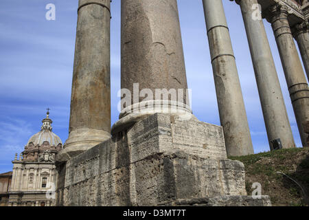 Surviving columns of the Temple of Saturn in the Imperial Forum in Rome Italy Stock Photo