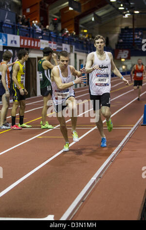 Ben Scheetz passing the baton to Travis Mahoney, NJ/NY Track Club competing in the Men's Club Distance Medley Relay Stock Photo