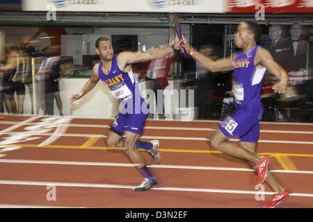 Winston McCormock passing the baton to Jonathan Santana, University at Albany in the Men's Club 4x200m at the 2013 Millrose Stock Photo