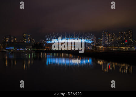Nightime photo of BC Place Stadium in Vancouver, BC, Canada with reflection in the waters of False Creek. Stock Photo