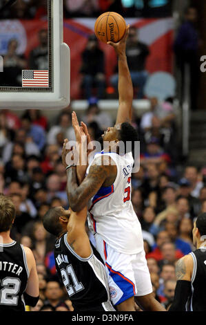 Feb. 21, 2013 - Los Angeles, California, U.S - February 21, 2013: Los Angeles, CA. Los Angeles Clippers center DeAndre Jordan (6) goes up for a slam dunk over San Antonio Spurs power forward Tim Duncan (21) during the NBA game between the between the Los Angeles Clippers and the San Antonio Spurs at Staples Center in Los Angeles, CA. David Hood/CSM. Stock Photo