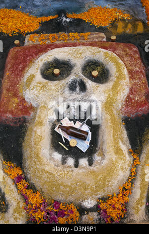 Sand painting of skull depicting common human vices created for Day of the Dead festival, Oaxaca, Mexico. Stock Photo