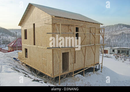 New Home under Construction with Ladder and Blue Sky Stock Photo