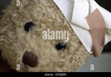 The injured head of a fleecy teddy bear is band-aided. Photo: Alice Mikyna Stock Photo