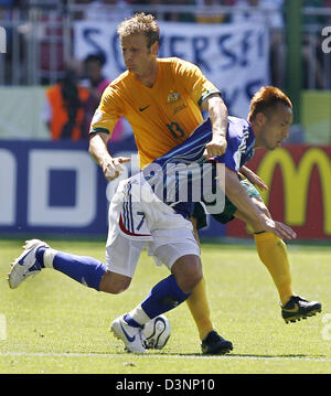 Australian player Vince Grella (L) fights for the ball with Hidetoshi Nakata from Japan during the group F match of 2006 FIFA World Cup between Australia and Japan in Kaiserslautern, Germany, Monday 12 June 2006. Photo: RONALD WITTEK +++ Mobile Services OUT +++ Please also refer to FIFA's Terms and Conditions. + Stock Photo
