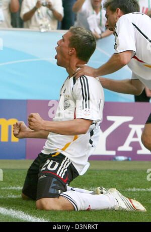 German striker Lukas Podolski (L) celebrates with his team-mate Bernd Schneider (R) after scoring his second goal during the 2006 FIFA World Cup round of 16 match Germany vs Sweden in Munich, Germany, Saturday 24 June 2006. DPA/BERND WEISSBROD +++ Mobile Services OUT +++ Please refer to FIFA's terms and conditions +++(c) dpa - Bildfunk+++ Stock Photo