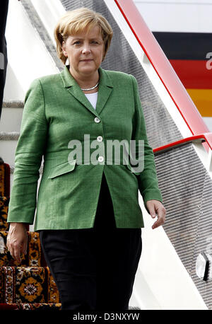 German Chancellor Angela Merkel leaves her plane at the airport in St Petersburg, Russia, Saturday, 15 July 2006. Merkel will take part in the G8 summit from 15 July to 17 July in St Petersburg. Photo: Bernd Settnik Stock Photo