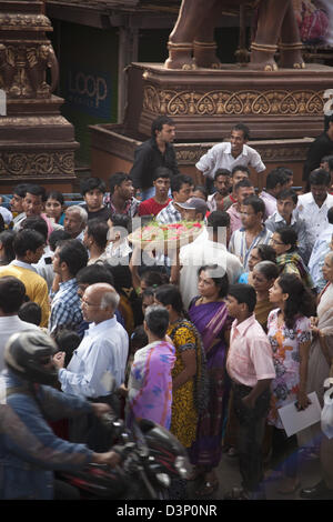 Crowd at a temple during religious procession of Ganpati visarjan ceremony, Mumbai, Maharashtra, India Stock Photo