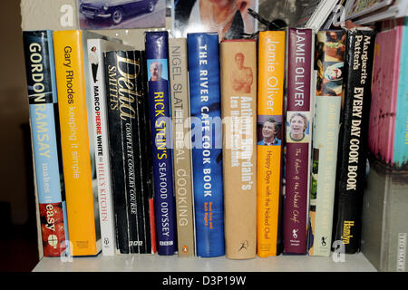 Row of cookbooks in kitchen written by television celebrity chefs Stock Photo