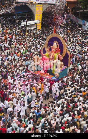 Crowd at religious procession during Ganpati visarjan ceremony, Mumbai, Maharashtra, India Stock Photo