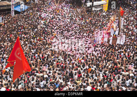 Crowd at religious procession during Ganpati visarjan ceremony, Mumbai, Maharashtra, India Stock Photo