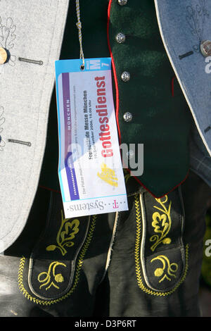 An admission ticket hangs in front of a pair of traditional Bavarian leather trousers prior to the open air Eucharistic mass held by Pope Benedict XVI in Munich, Germany, Sunday, 10 September 2006. Pope Benedict XVI visits his home state Bavaria until 14 September 2006. Photo: Stephan Jansen Stock Photo