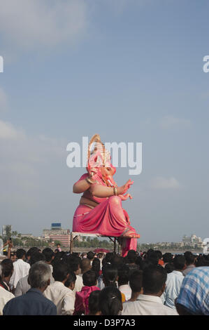 Crowd at religious procession during Ganpati visarjan ceremony, Mumbai, Maharashtra, India Stock Photo