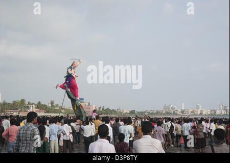 Crowd at religious procession during Ganpati visarjan ceremony, Mumbai, Maharashtra, India Stock Photo