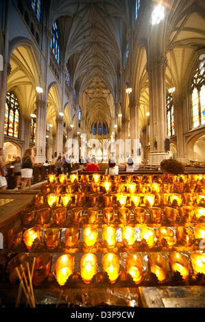 Candles light up the stunning ornate interior of the neo-gothic St Patrick's Cathedral in New York City. Stock Photo