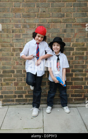 Two brothers hanging out in the street. Stock Photo