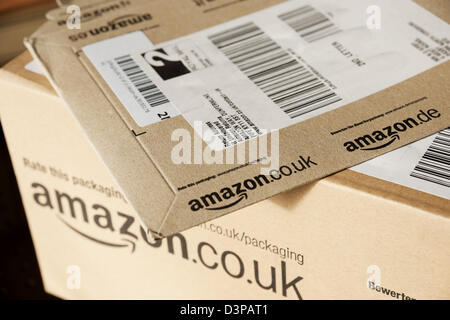 Close up of Amazon packages package parcel box home online internet delivery shopping retail company England UK United Kingdom GB Great Britain Stock Photo