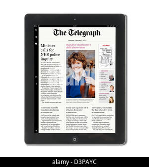 Reading the app edition of the Daily Telegraph newspaper on a 4th Generation iPad, UK Stock Photo