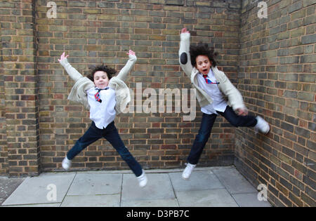 Two brothers hanging out in the street. Stock Photo