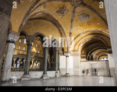 Side Aisle at Hagia Sophia. Blurred tourists walk through a side gallery on polished marble floors. Stock Photo