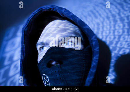 portrait of hacker with mask and binary code background Stock Photo - Alamy