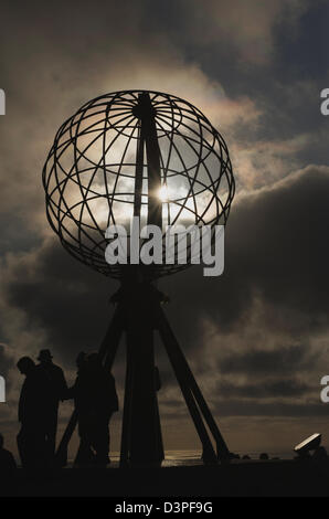 The midnight sun at a stormy Northcape in Northern Norway Stock Photo