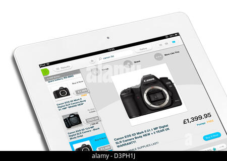 Looking at cameras with the ebay app on a 4th generation Apple iPad, UK Stock Photo