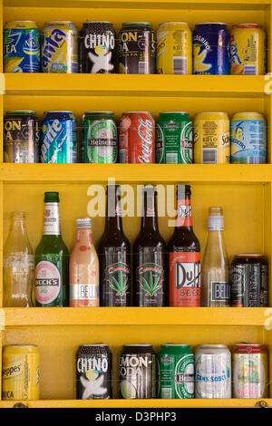 Soft drink Cans and Beer on a shelf Stock Photo