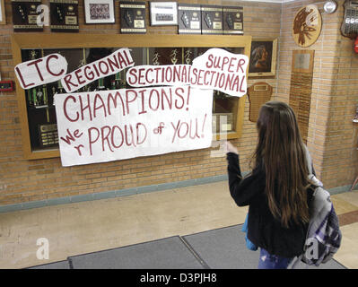 Feb. 20, 2013 - Annawan, Iowa, U.S. - An Annawan High School student walks past signs supporting the girls basketball team Wednesday, Feb. 20, 2013, on her way out after school. The team plays Friday in the semifinals in Bloomington. (Credit Image: © John Schultz/Quad-City Times/ZUMAPRESS.com) Stock Photo