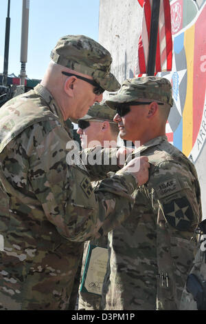 US Gen. Raymond Odierno, the Chief of Staff of the Army, pins 1st Lt. Christopher Villarreal with a Combat Infantryman Badge February 22, 2013 at Forward Operating Base Masum Ghar, Afghanistan. Stock Photo