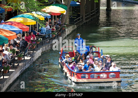 Tourist boat on San Antonio River along the Riverwalk, San Antonio, Texas USA Stock Photo