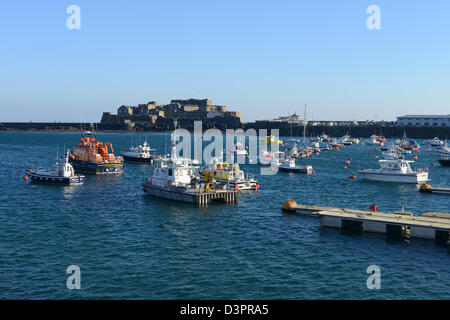 Guernsey marine ambulance and lifeboat moored with other boats in St Peter Port, Guernsey Stock Photo