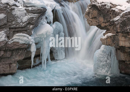 This image was captured during the winter season. This is Elbow Falls, Bragg Creek, Alberta Canada Stock Photo