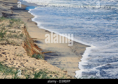 Beach erosion after storm activity Gold Coast Australia, pristine sandy beaches left with dangerous scarping and dark sands Stock Photo