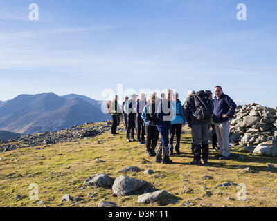 Ramblers group hiking on top of Moel Faban mountain in mountains of northern Snowdonia National Park. Bethesda, Gwynedd, North Wales, UK, Britain Stock Photo