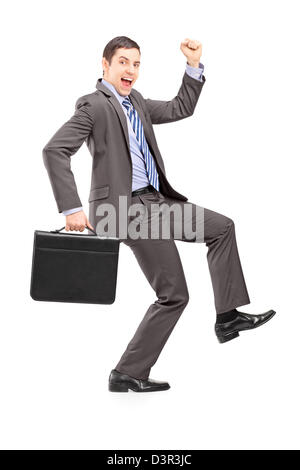 Full length portrait of an excited businessman with a briefcase gesturing happiness isolated on white Stock Photo