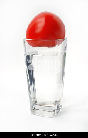 Tomato in the glass on white background Stock Photo