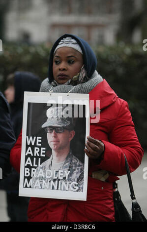 London, UK. 23rd February 2013. Woman holds placard reading 'We are all Bradley Manning' as part of events held across the US and Europe, a picket is held at the US embassy in London, to mark 1,000 days of alleged Wikileaks whistleblower Pte. Bradley Manning's imprisonment. London, UK, 23 February 2013. Credit:  martyn wheatley / Alamy Live News Stock Photo