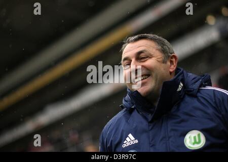 Mainz, Germany. 23rd February 2013. Wolfsburg's managing director sports, Klaus Allofs, smiles before the start of the Bundesliga soccer match between FSV Mainz 05 and VfL Wolfsburg at Coface Arena in Mainz, Germany, 23 February 2013. Photo: FREDRIK VON ERICHSEN/dpa/Alamy Live News  (ATTENTION: EMBARGO CONDITIONS! The DFL permits the further  utilisation of up to 15 pictures only (no sequntial pictures or video-similar series of pictures allowed) via the internet and online media during the match (including halftime), taken from inside the stadium and/or prior to the start of the match. The DF Stock Photo