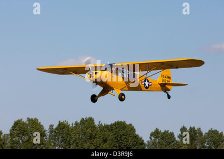 Piper L-18C Super Cub 51-15319 A319 G-FUZZ in flight taking-off from Breighton Airfield Stock Photo