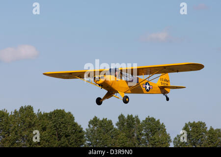 Piper L-18C Super Cub 51-15319 A319 G-FUZZ in flight taking-off from Breighton Airfield Stock Photo