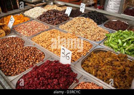 Mahane Yehuda Market (Shuk), selection of dried fruits and nuts in silver containers Stock Photo