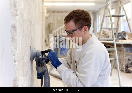 Berlin, Germany, plasterer's apprentice milled smooth a Uebungswand Stock Photo
