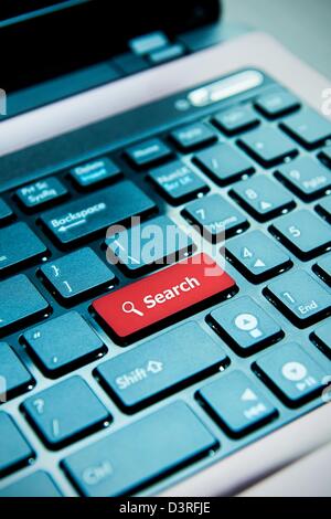 Search red button on laptop keyboard Stock Photo