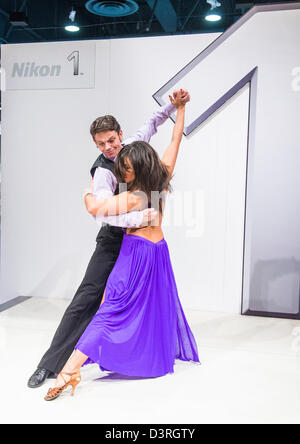Couple dancing during the launch of a new camera model at Nikon booth at CES show held in Las Vegas Stock Photo