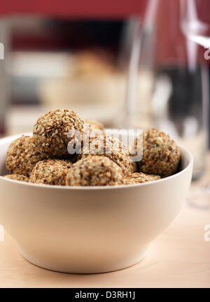 Tuna ricotta parsley balls rolled in sesame seeds. Stock Photo