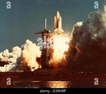 A glossy photo from the Space Shuttle Program features astronauts Jim ...