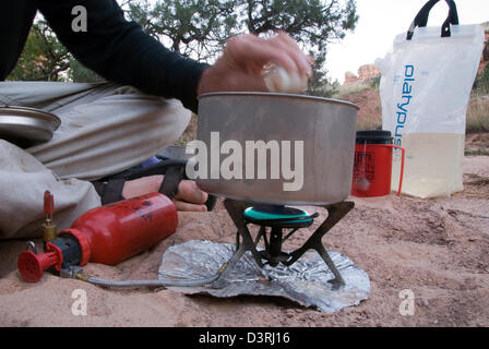 Cooking a meal on a backpack trip in Canyonlands National Park, Utah. Stock Photo