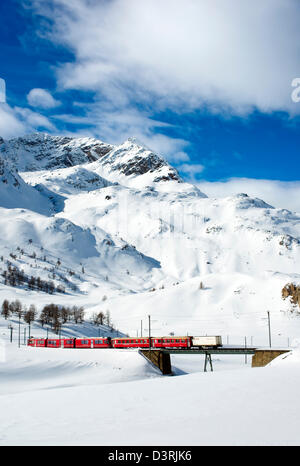 Mountain train at Lago Bianco Bernina Pass in Winter, Grisons, Switzerland Stock Photo