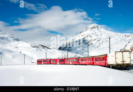 Mountain train at Lago Bianco Bernina Pass in Winter, Grisons, Switzerland